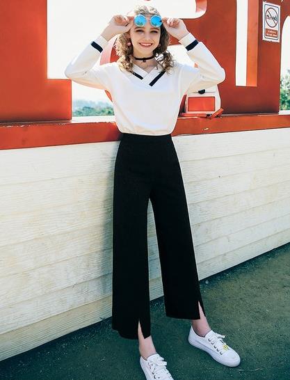 高腰百褶裙搭配灯笼袖V领上衣：5款彰显大长腿（图）