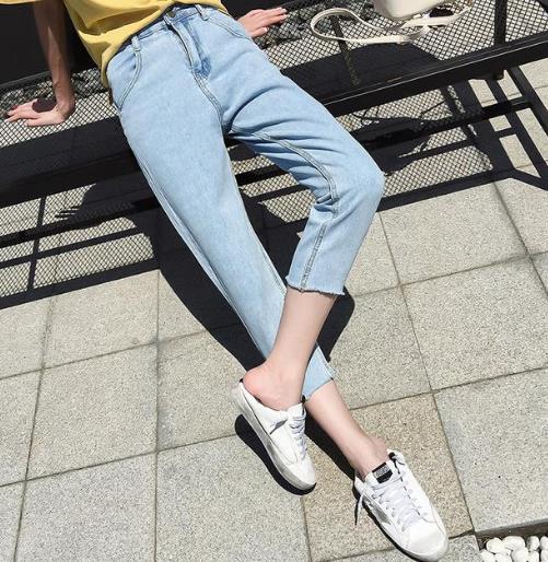 胖美眉专属牛仔裤：显高显瘦黑色破洞小脚裤（图）