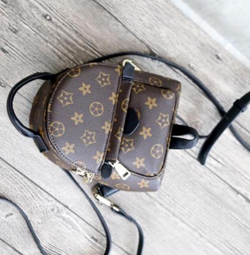 韩版牛皮撞色迷你双肩包：简约又不失时尚（图）