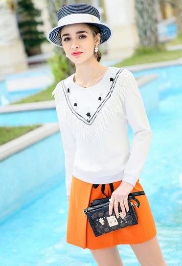 短裤搭配高腰套头流苏T恤：轻松打造大长腿（图）