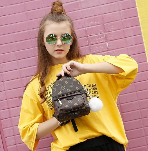 链条包搭配高腰格子毛呢包裙：淑女范儿十足（图）