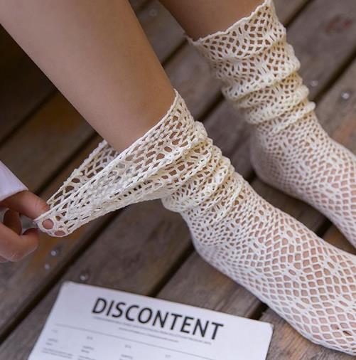 时尚又性感就穿新款镂空渔网堆堆袜（图）