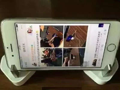 苹果充电器的新用途 成了手机支架、开瓶器（图）