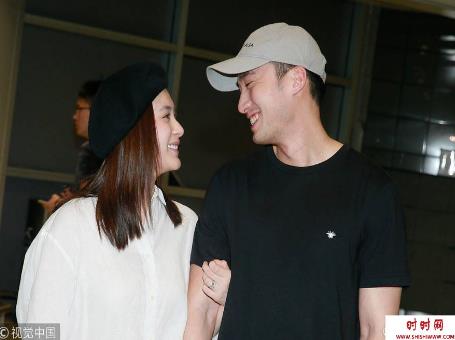 阿娇婚后返港戴巨型鸽子蛋 挽手老公甜蜜对视（图）